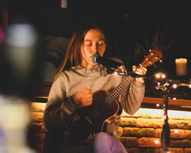 Couple playing guitar